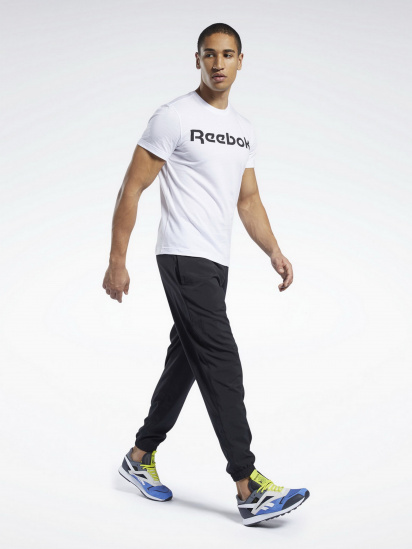 Штаны спортивные Reebok Training Essentials Woven Cuffed модель FP9141 — фото 4 - INTERTOP